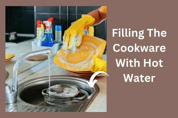Filling The Cookware With Hot Water