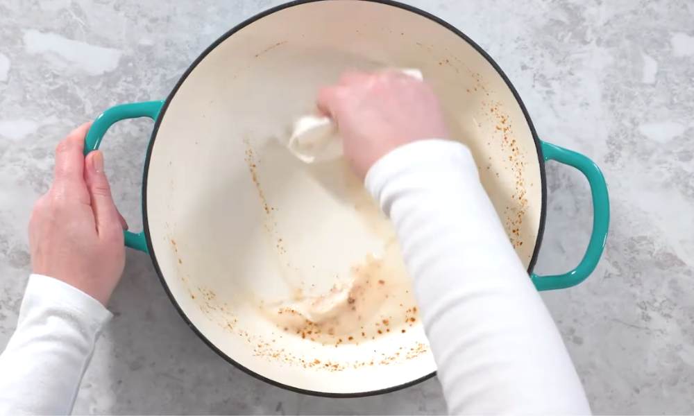 Clean enamel cookware use an abrasive cleanser