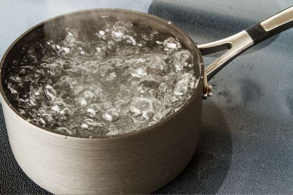Boil Water And Baking Soda In The Pan