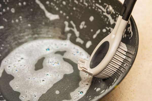 Use A  Scrubbing Brush On A Pans
