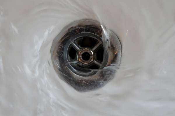Flushing The Drain With Water