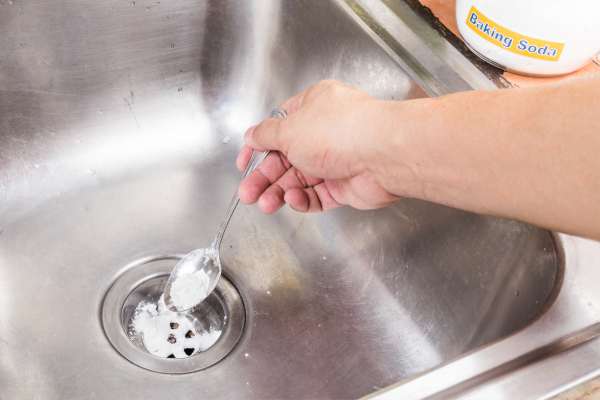 Pour Baking Soda And Vinegar Into The Drain