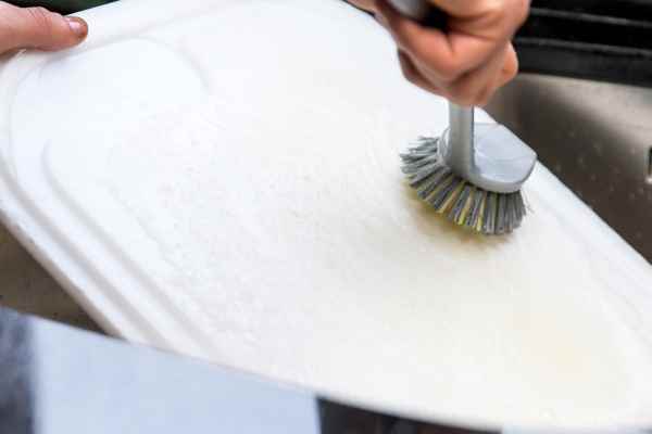 Clean The Cutting Boards With A Scrub Brush