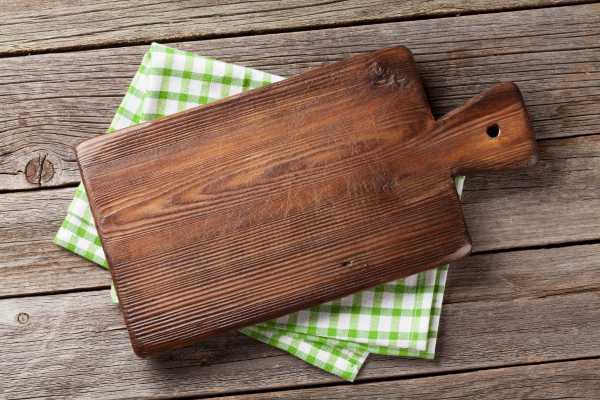 Rinsing The Cutting Board With Clean Water