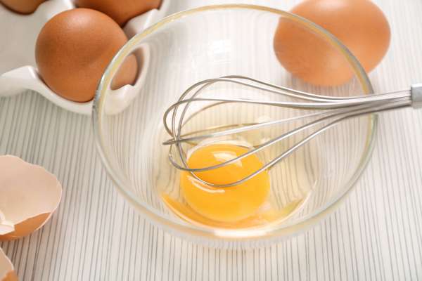 Whisking Eggs In Small Bowls